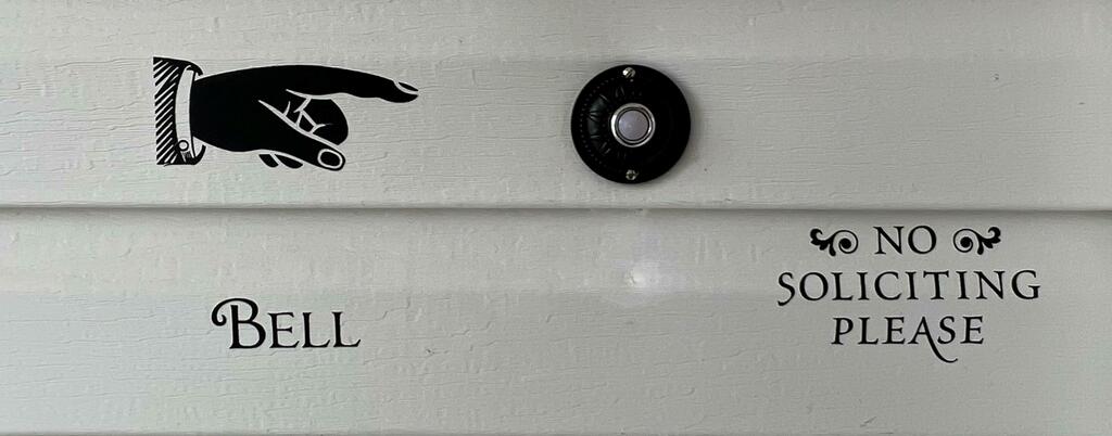 DH1652L Wired Circle Doorbell Button Installed on Wall