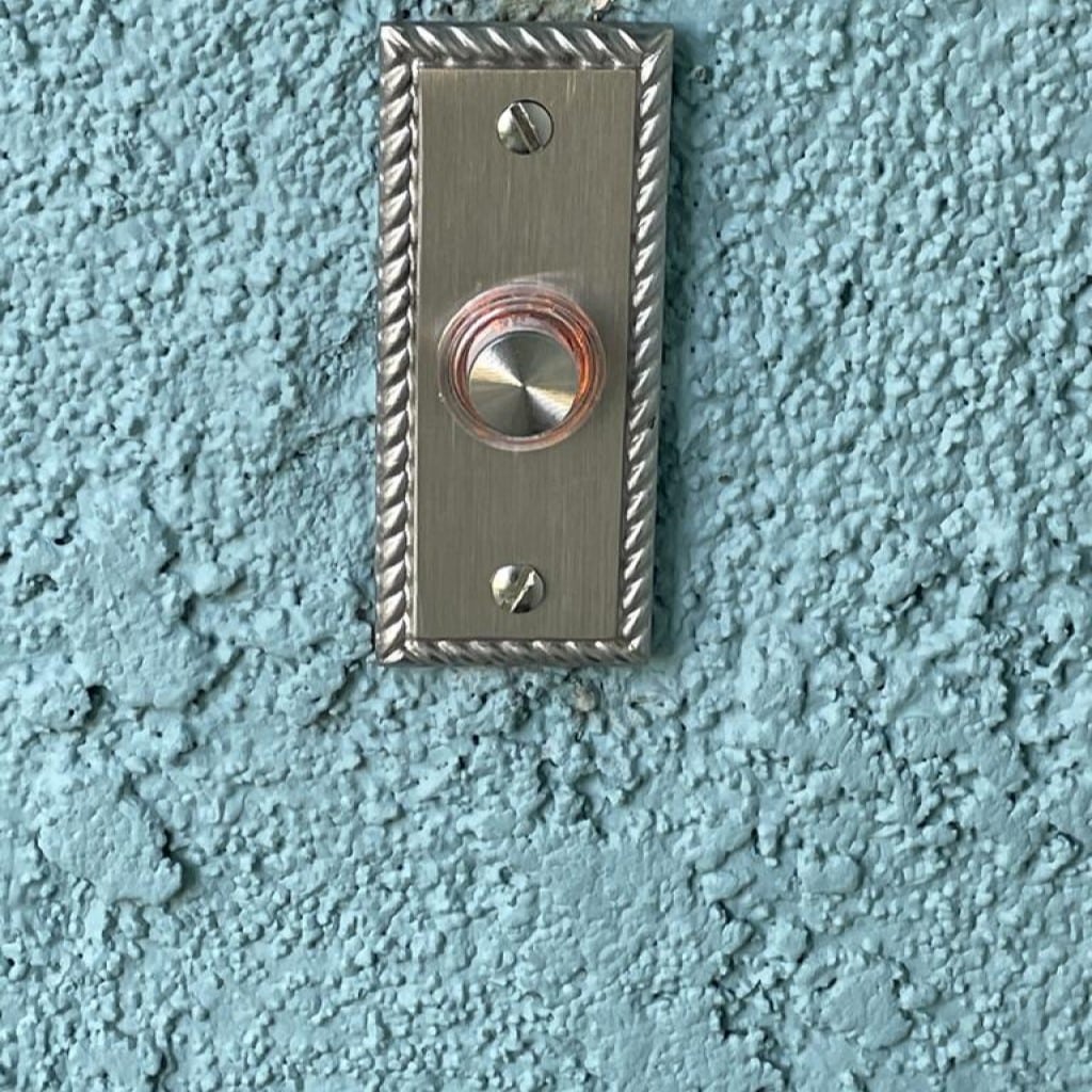 DH1667 Wired Brass Doorbell Button Installed on Wall
