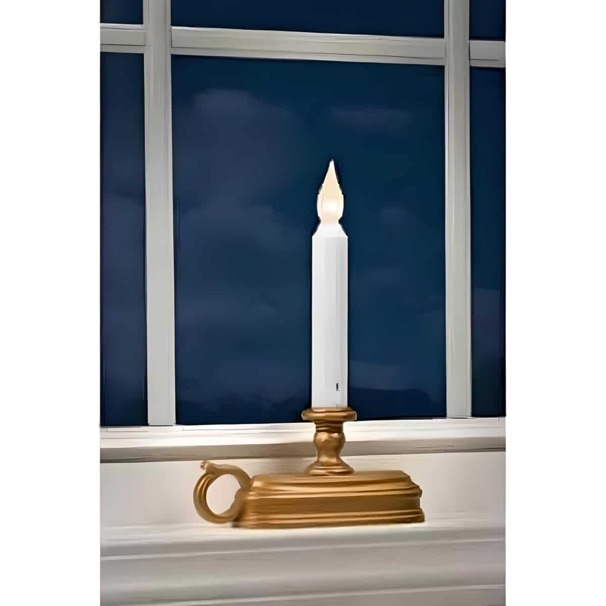 FPC1525B Single Tier LED Window Candle W/ White Flame in Aged Brass Base in a Window at Night